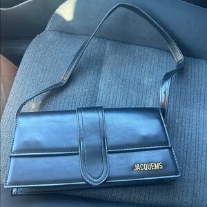 Jacquems Black Leather Clutch with Gold Logo